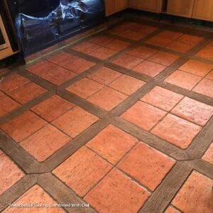 image of terracotta flooring combined with wooden inserts